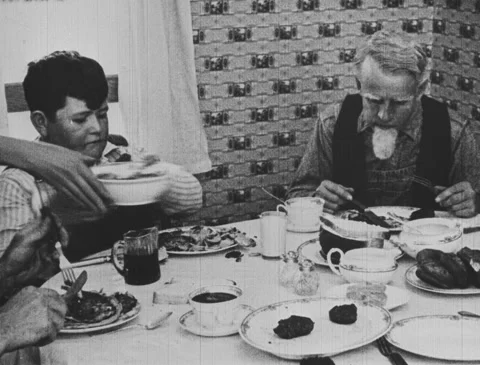 1920s - Boy and old man eating breakfast Vídeo Stock 166537028