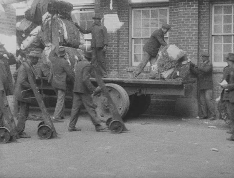 1920s - Cotton mill - Men unloading bales of cotton Stock Footage 170507416