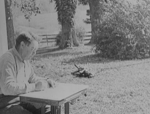1920s - Farmer writes letter, mails it Stock Footage 166546845