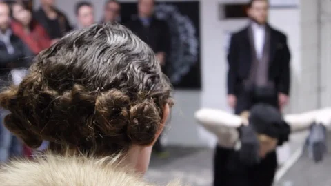 1920’s flapper dress dances in the background as woman with pin curls watches Stock-Footage 107618274