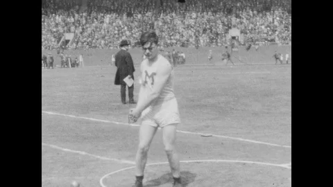 1920s: Full stadium, huge crowd, track and field competition, hammer throw, man Stock Footage 126007672