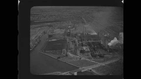 1920s: Looking down on factory from sky. Looking down on large factory complex. Stock Footage 161168868