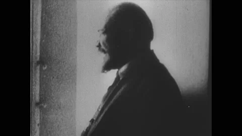 1920s: Trotsky sits at desk, writes. Lenin talks. Joseph Stalin walks with Stockbeeldmateriaal 148157035