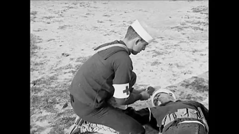 1920s - US Navy midshipmen practice first aid in the field. Stock Footage 155856959