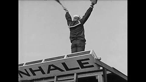 1920s - A US Navy sailor helps lead a calisthenics class for women. Stock Footage 155856685