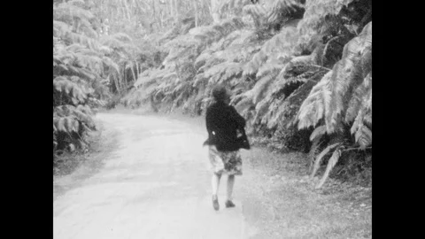 1920s: Woman runs to the side of the roa... | Stock Video | Pond5