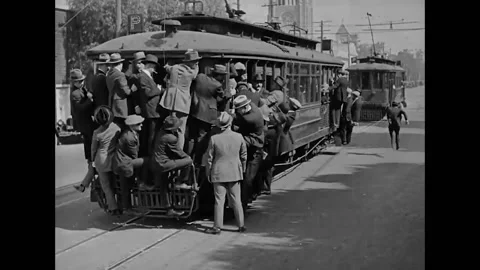 1923 - In this silent comedy, a man (Harold Lloyd) gets on the wrong trolley and Stock Footage 205512199