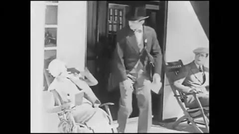 1925 - in this silent comedy, a man on a cruise ship announces to a woman that Stock Footage 246362473