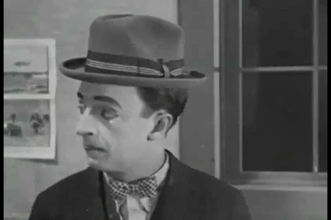 1926 - Caddies make fun of a man who cant afford to join a country club. He Stock Footage 99668698