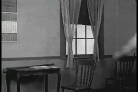 1926 - During an initiation ceremony to become a caddie, a man accidentally Stock Footage 99668706