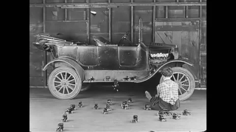 1926 - In this short comedy starring Charley Bowers, a man watches tiny cars Video stock 232882828