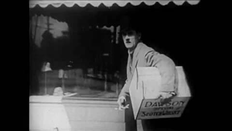1926 - In this silent comedy, a bootlegger avoids crossing a street where a Vídeos de archivo 203754680