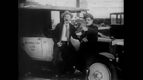1926 - In this silent comedy, a bootlegger tries to evade a traffic cop. Stock Footage 203756535