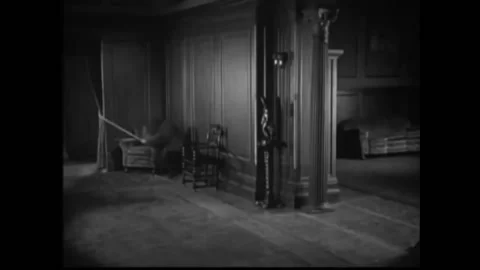 1926 - In this silent comedy, a man tricks two people into pulling a rope, Stock Footage 226600799