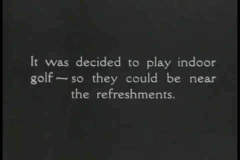 1926 - Two men are suckered into a game of indoor golf. Stock-Footage 99668647