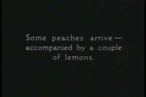 1926 - Two odd fellows come to a clubhouse to golf. One rolls his own cigarette, Stock Footage 99668671