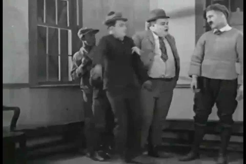 1926 - Two odd men flirt with a girl in hopes that shell choose them to be her Video stock 99668605