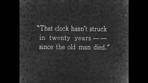1927 - In this horror comedy film, a clock strikes as people sit down around a Stock Footage 217371325