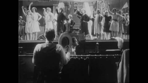 1929 - In this American Pre-Code musical, a producer stops a group of women Stock Footage 220286078
