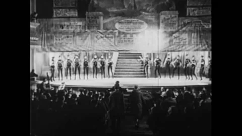 1929 - In this American Pre-Code musical, a group of women descend down a flight Stock Footage 220286097