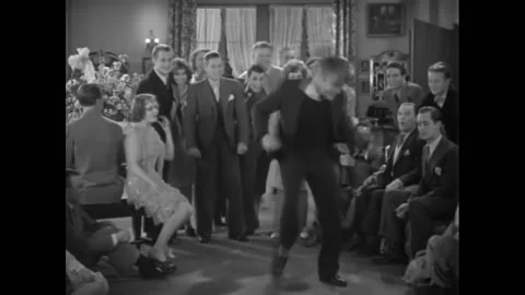 1929 - In this musical, a college student performs a wild dance at a party. Stock Footage 159336459