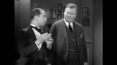 1930 - In this American pre-code crime action film, a detective questions a man Stock Footage 238772569