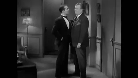 1930 - In this American pre-code crime action film, an officer interrogates a Stock Footage 238772982