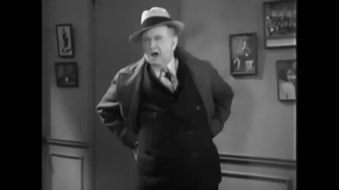 1930 - In this American pre-code crime action film, a woman interrupts a Stock Footage 238773094