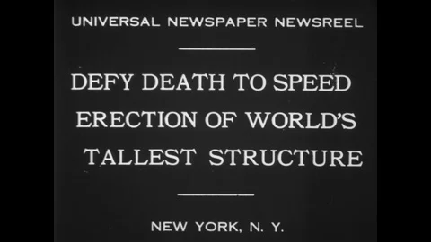 1930 - Construction workers are seen at the top of the Empire State Building, Stock Footage 128984442