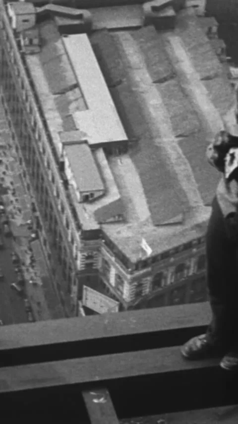 1930 - Construction workers are seen at the top of the Empire State Building, Stock Footage 284125222
