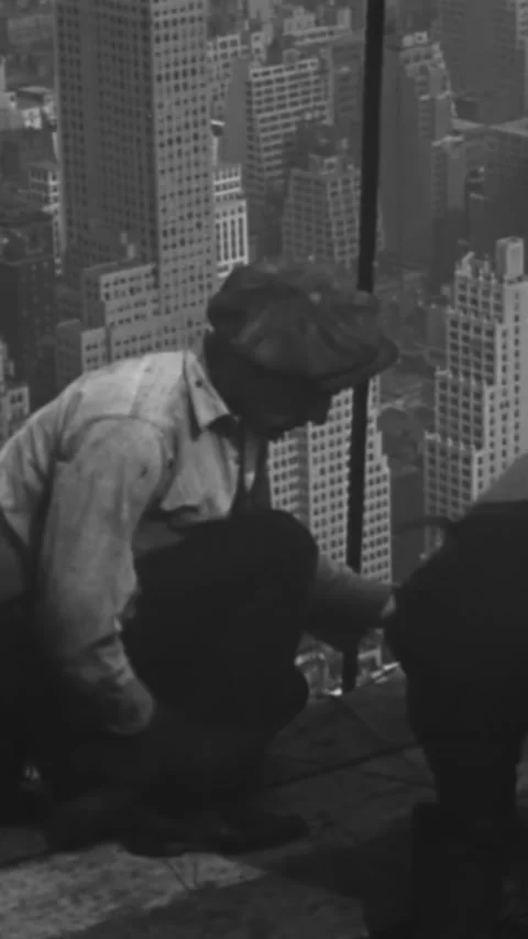 1930 - Construction workers working on the Empire State Building have a good Stock Footage 284125898