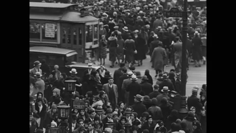 1930 - Crowds do their Christmas shopping in an open market. Stock Footage 238601561
