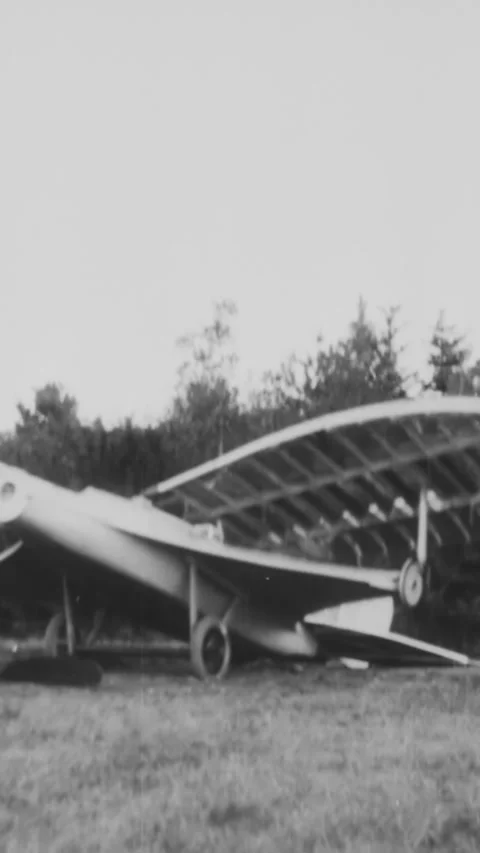 1930 - Two inventors wreck their experimental aircraft by testing its wings. Stock Footage 287571707