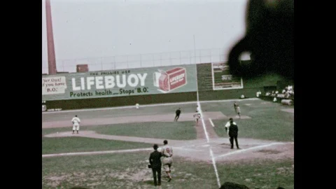 1930s: Babe Ruth at bat on baseball field. Pitcher pitches baseball. Babe Ruth Stock Footage