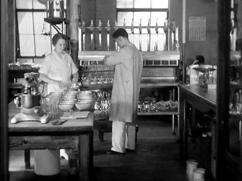 1930s clip of a scientist in a laboratory testing flour contents for bread Stock Footage 79464903