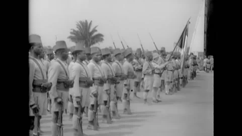 1930s - The drum and bugle corps of a French African unit plays in the desert. Stock Footage 162750033