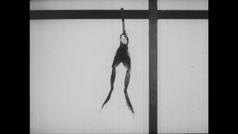 1930s: Frog legs wiggle on hook. Stock Footage 126011155
