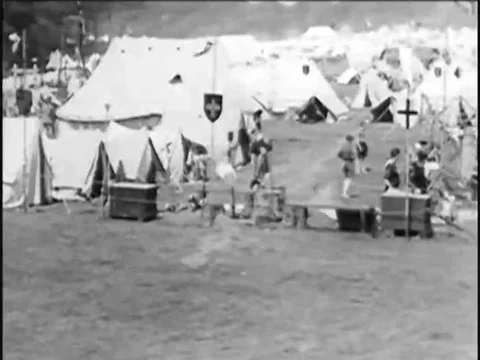 1930s A group of Boy Scouts camp, march, and watch Native Americans perform at a Stock Footage 83213883