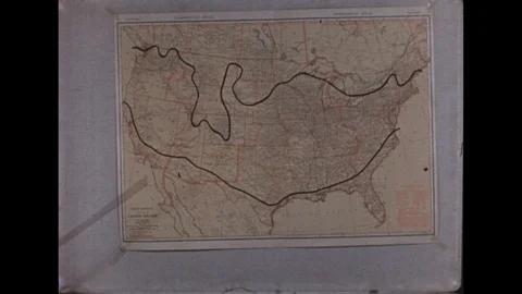 1930s: Hand moves pointer stick along map on wall. Stick points to lines running 動画素材 113951297