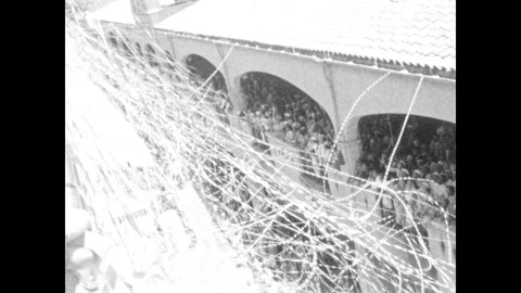 1930s: HAWAII: streamers between dock and ship. View from ship Stock Footage 87233186