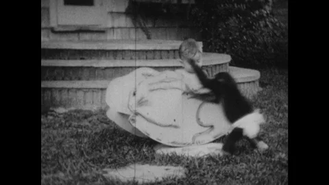 1930s: Human baby sits in wooden rocker ... | Stock Video | Pond5