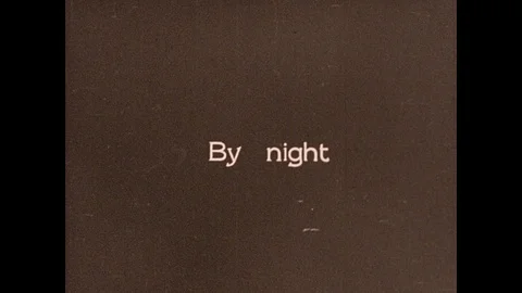 1930s: Intertitle card. Students sit in classroom. Man works on car engine. Man Stock Footage 94832261