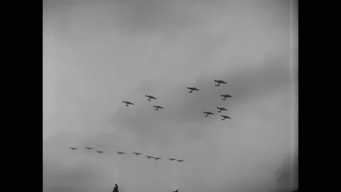 1930s - Luftwaffe planes fly above a military parade, where Adolf Hitler salutes Stock Footage 241605652