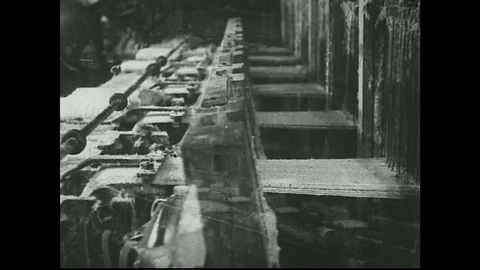 1930s -  Machine weaves asbestos Stock Footage 74688929