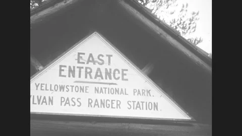 1930s: Man And Girl Pose At Yellowstone National Park Sylvan Pass Ranger Stock Footage