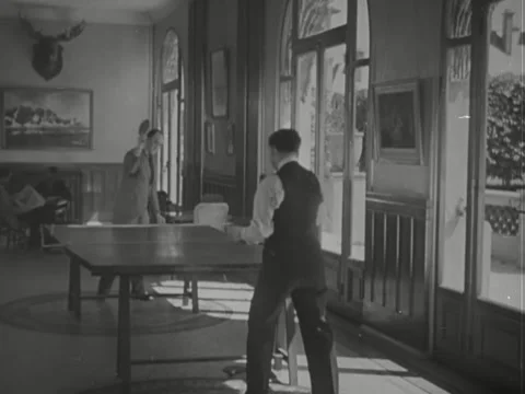 1930s: Men playing ping pong Stock Footage 229823928