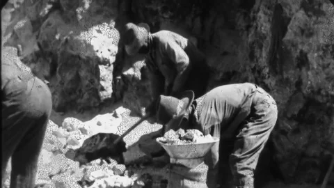1930s MINERS LOADING Sacks of Raw Ore Labor Vintage Film Industrial Home Movie Stock Footage