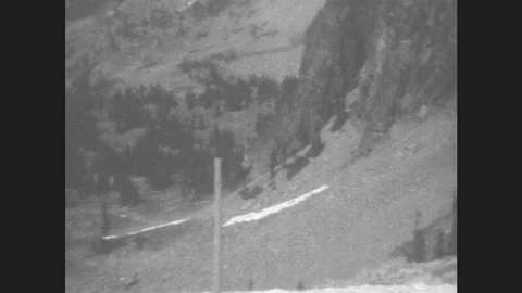 1930s: Mountains. Little Girl Stands And Walks On Side Of Mountain. Stock Footage