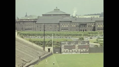 1930s: Outfield at Forbes Field and University of Pittsburgh buildings. Boys Stock Footage