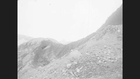 1930s: Pan Across Glacier. Close Up Of Rushing Water. Stock Footage
